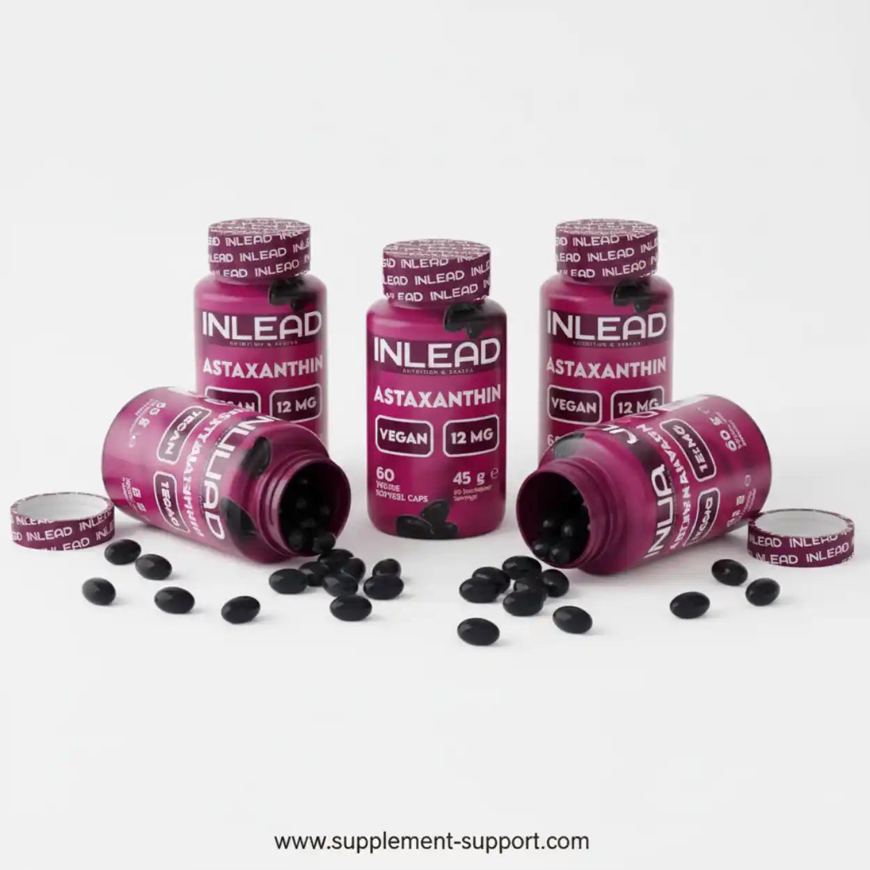 Mehrere Dosen INLEAD Astaxanthin Kapseln vegan 12mg, schwarze Kapseln auf weißem Hintergrund.