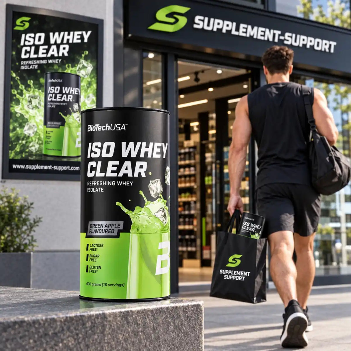 BioTech USA Iso Whey Clear Protein Pulver in grüner Apfel-Variante vor einem Supplement-Shop