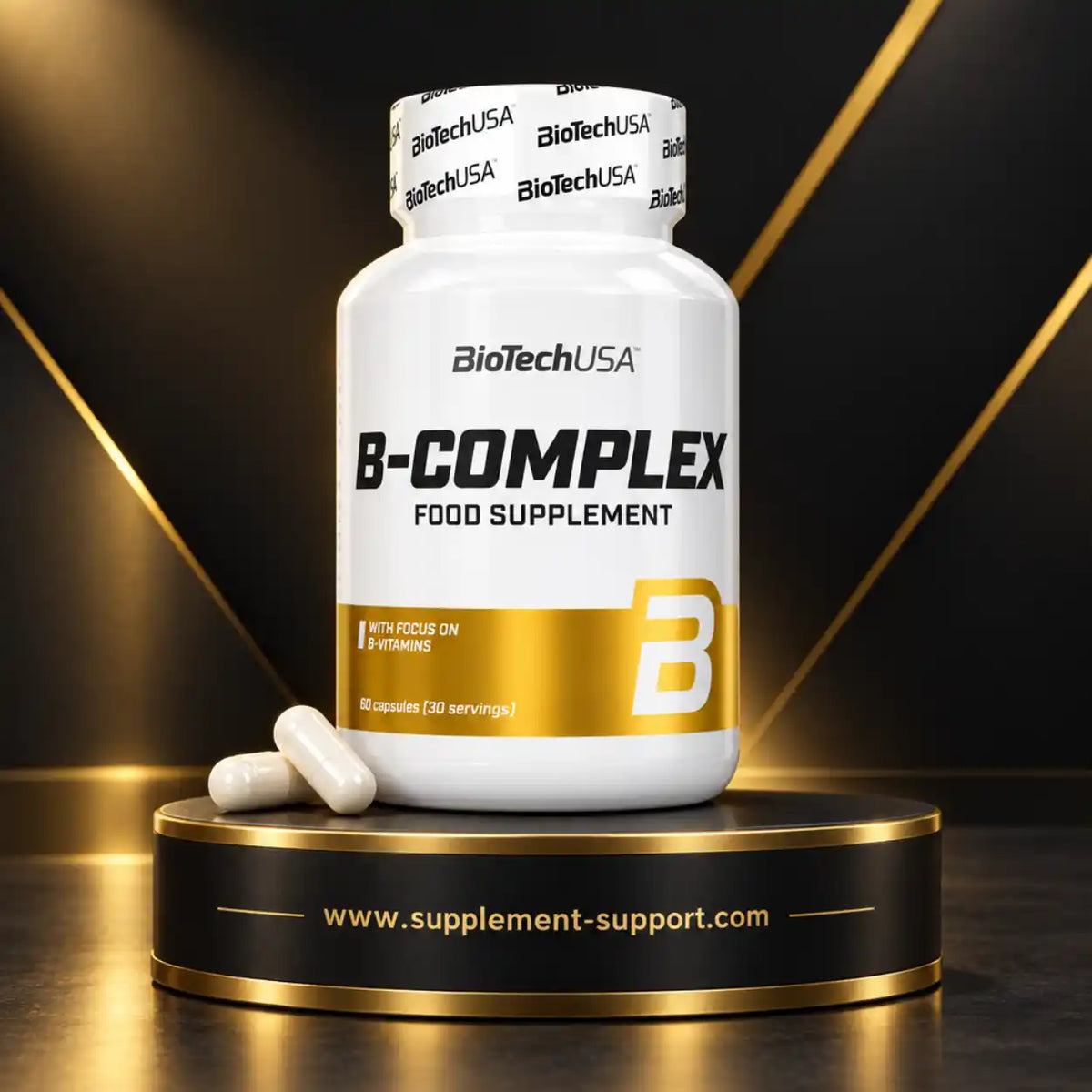 BioTech USA B-Complex Nahrungsergänzungsmittel, weiße Dose mit Kapseln auf goldenem Podest.