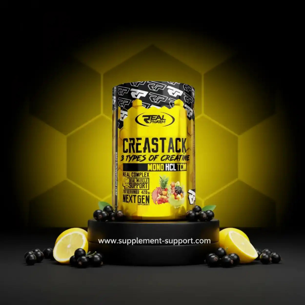 Real Pharm Creastack Creatin-Pulver, gelbe Dose, umgeben von Zitronen und schwarzen Johannisbeeren