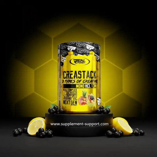 Real Pharm Creastack Creatin-Pulver, gelbe Dose, umgeben von Zitronen und schwarzen Johannisbeeren