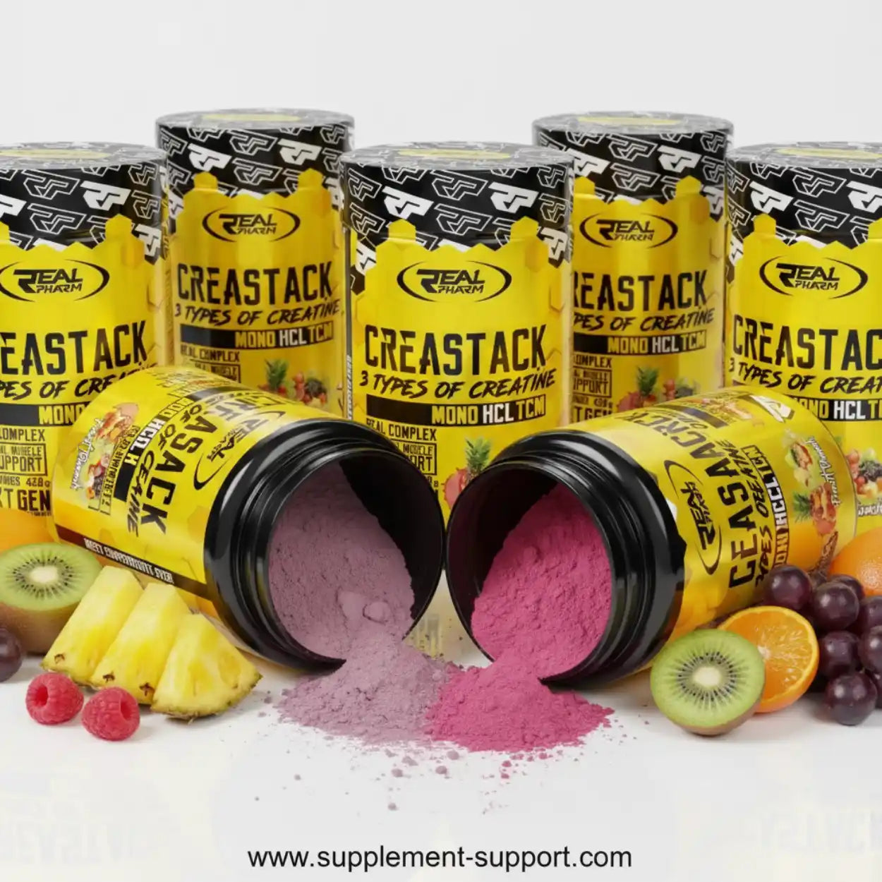 Real Pharm Creastack Creatin-Pulver in gelben Dosen mit Fruchtgeschmack, Früchte im Vordergrund